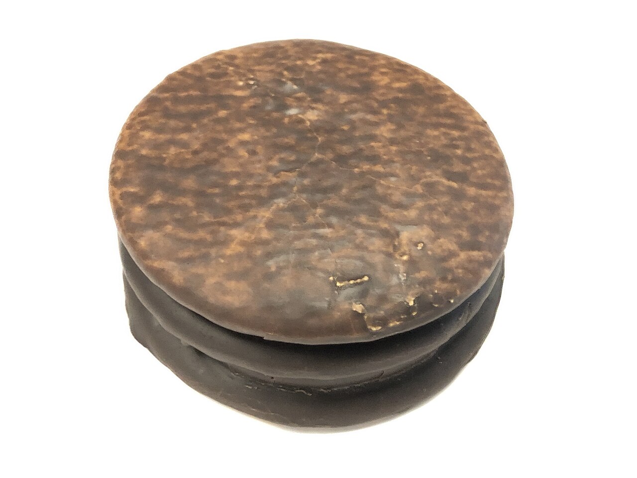 Single round mini moon pie coated in dark chocolate with a mottled tan top